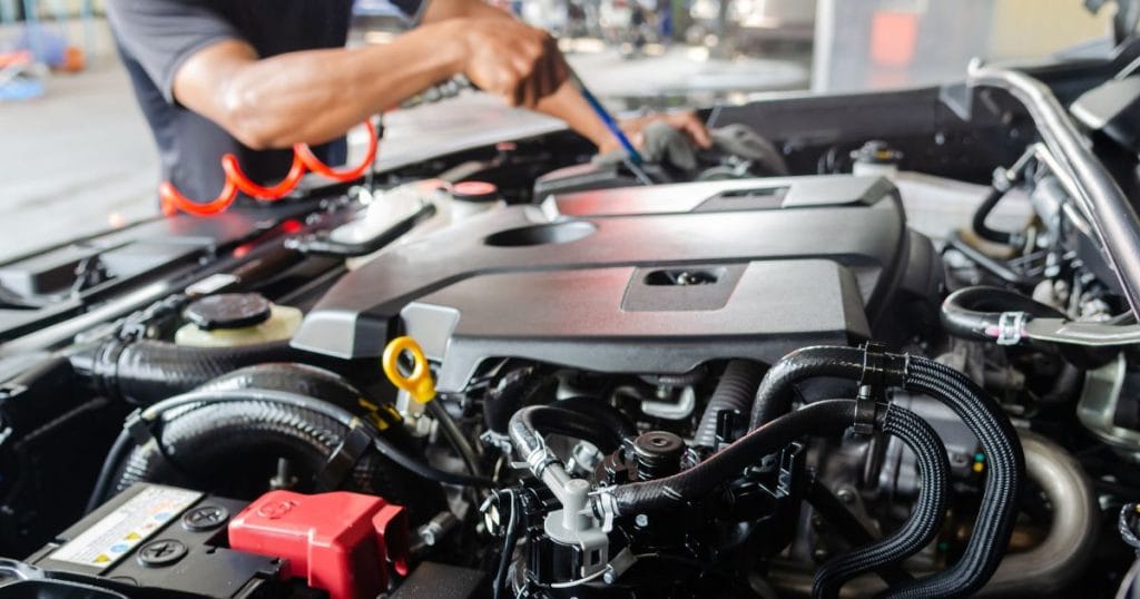 Image of a person doing winter car checks
