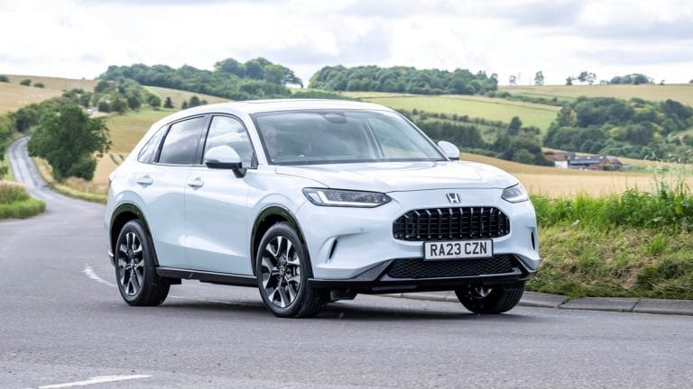 Platinum White Pearl Honda Z-RV Advance driving on country road
