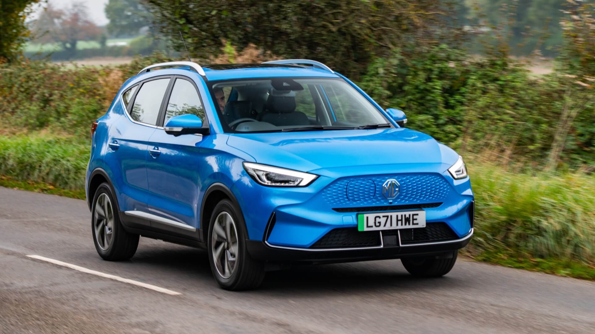 Blue MG ZS EV driving on road