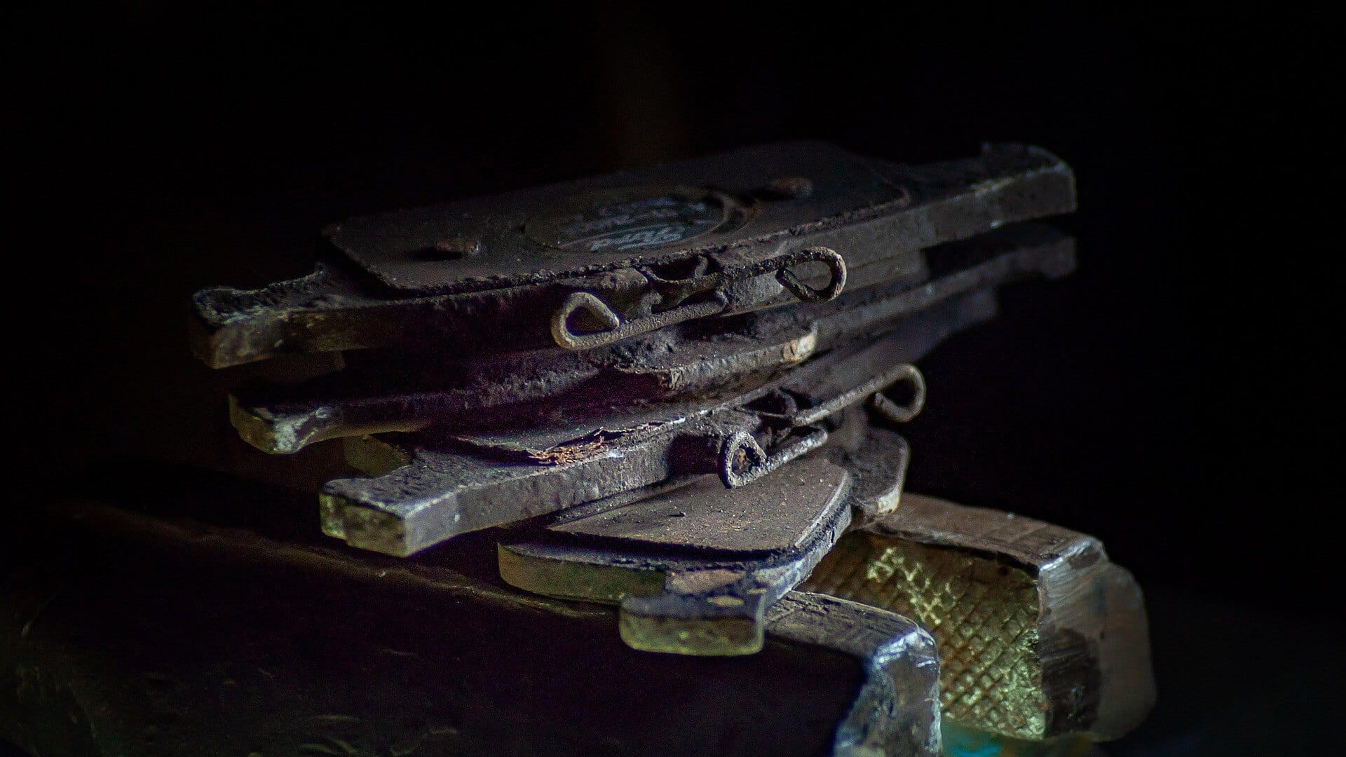 Photo of a stack of worn brake pads.