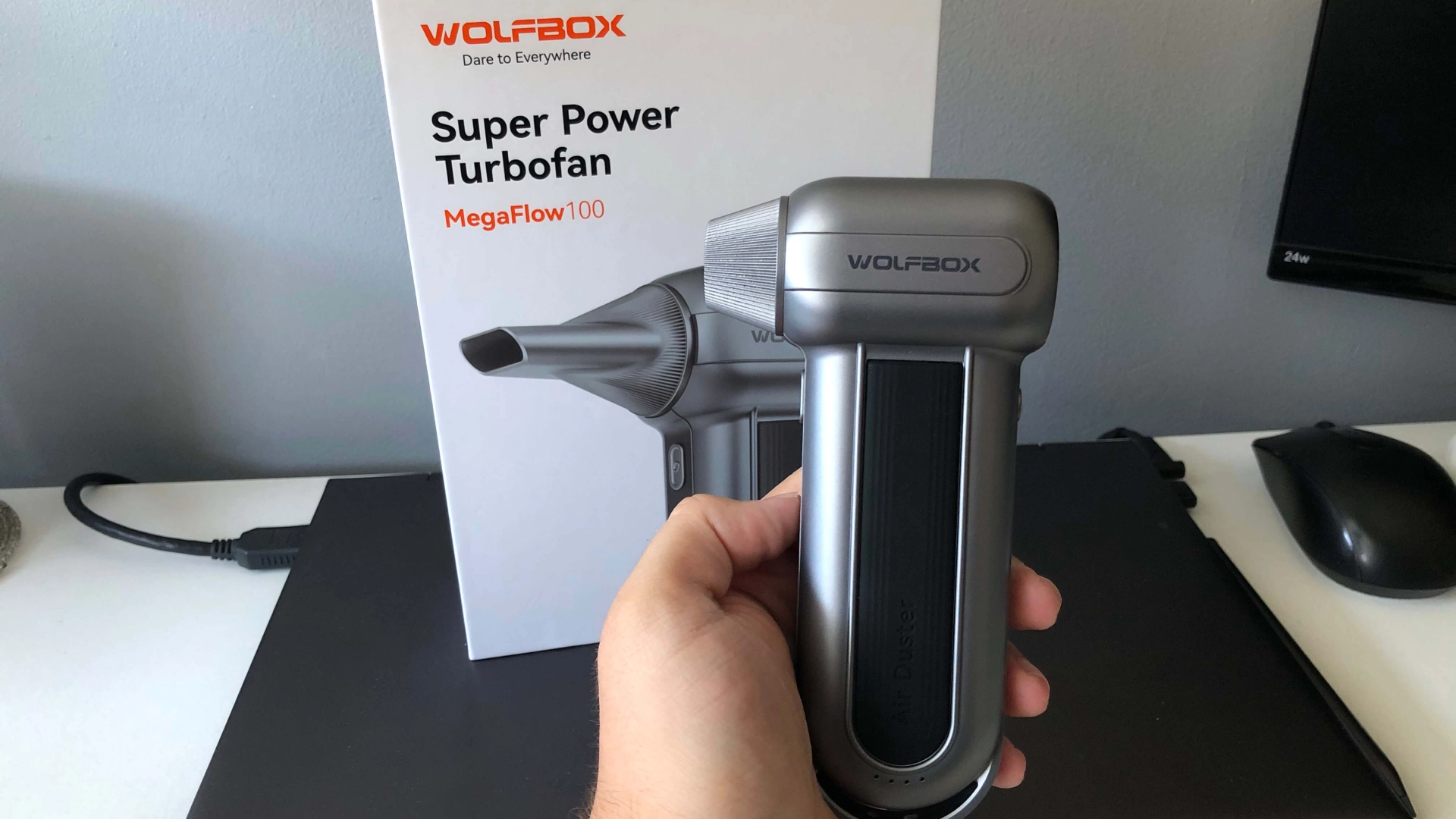 Dylan holding the Wolfbox portable air duster