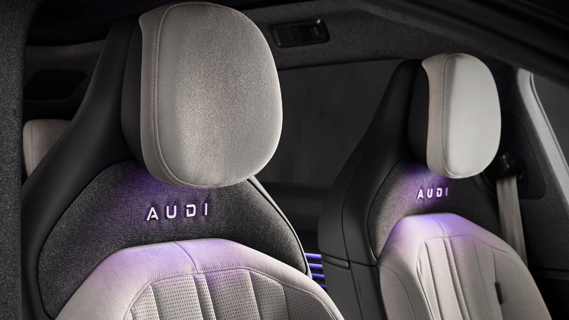 Photo of the seats inside the new AUDI E5, with illuminated AUDI lettering.
