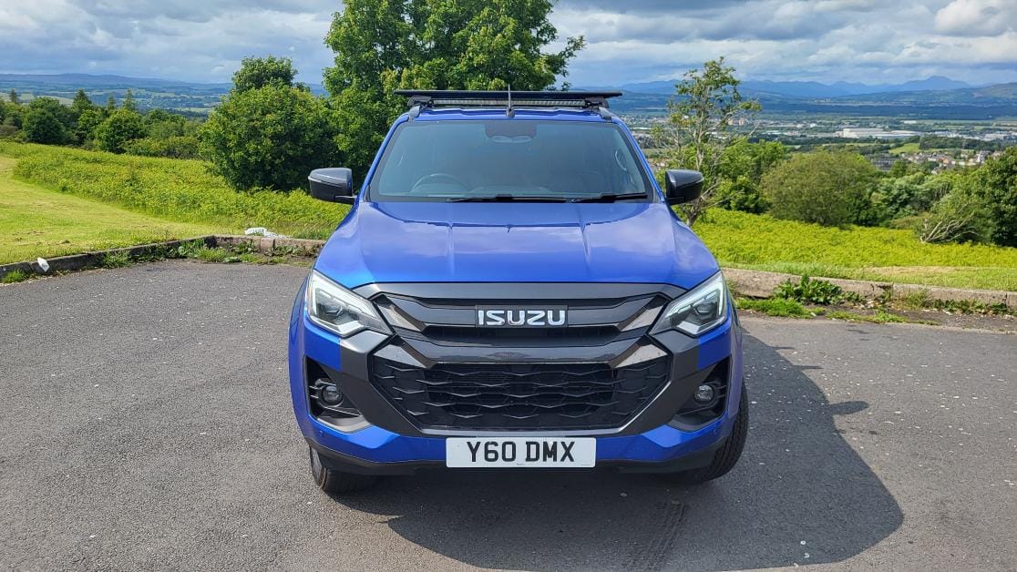 Front-view photo of the 2026 Isuzu D-Max V-Cross in Biarritz Blue, parked.