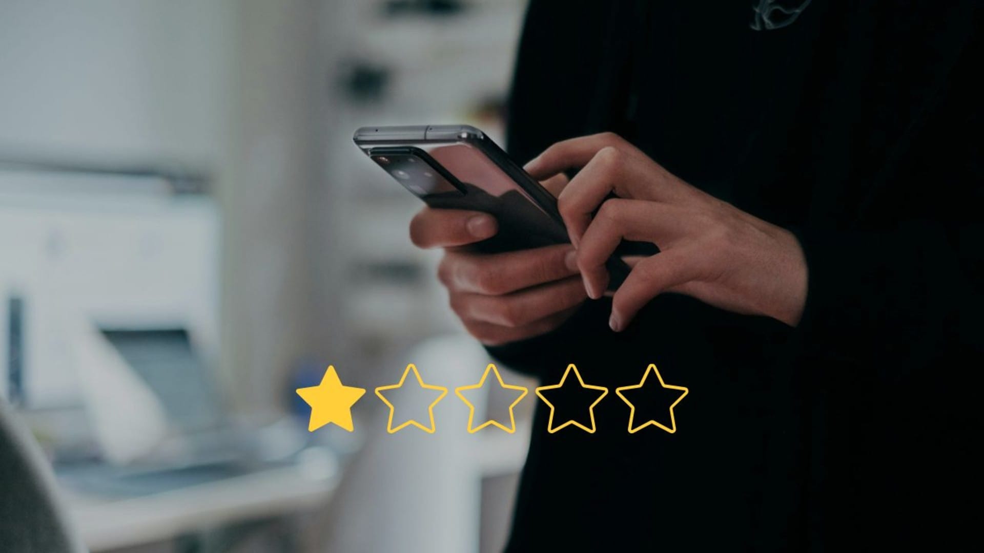 Image of a man holding a mobile phone with a 1-star rating graphic for Autotrader review.